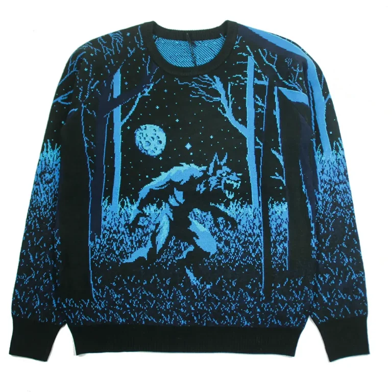Black and blue sweater with a moonlit forest scene.