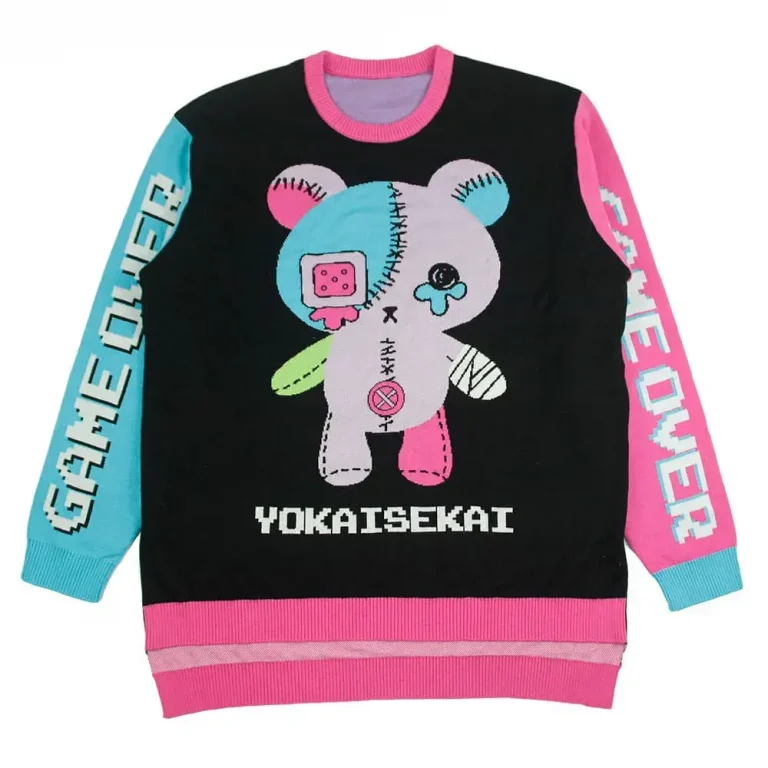 Black sweater with a patchwork character and contrasting pink and blue sleeves.
